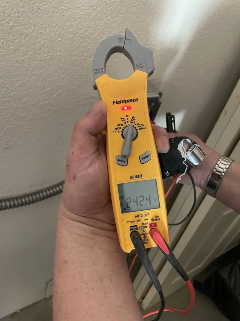 Voltage testing with clamp meter during Generator Installation in Tacoma